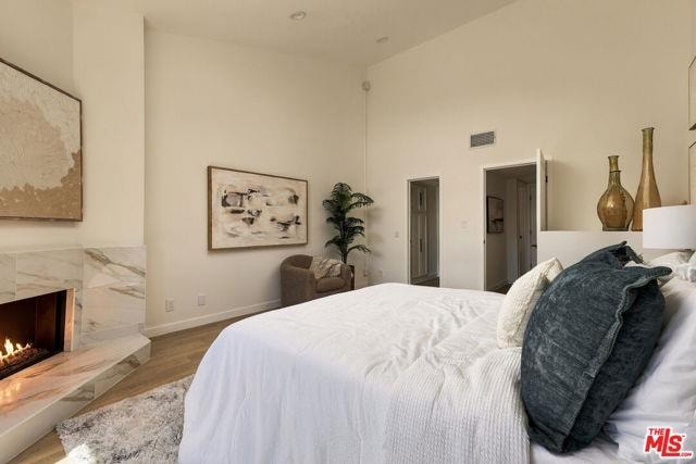 Bedroom with marble fireplace